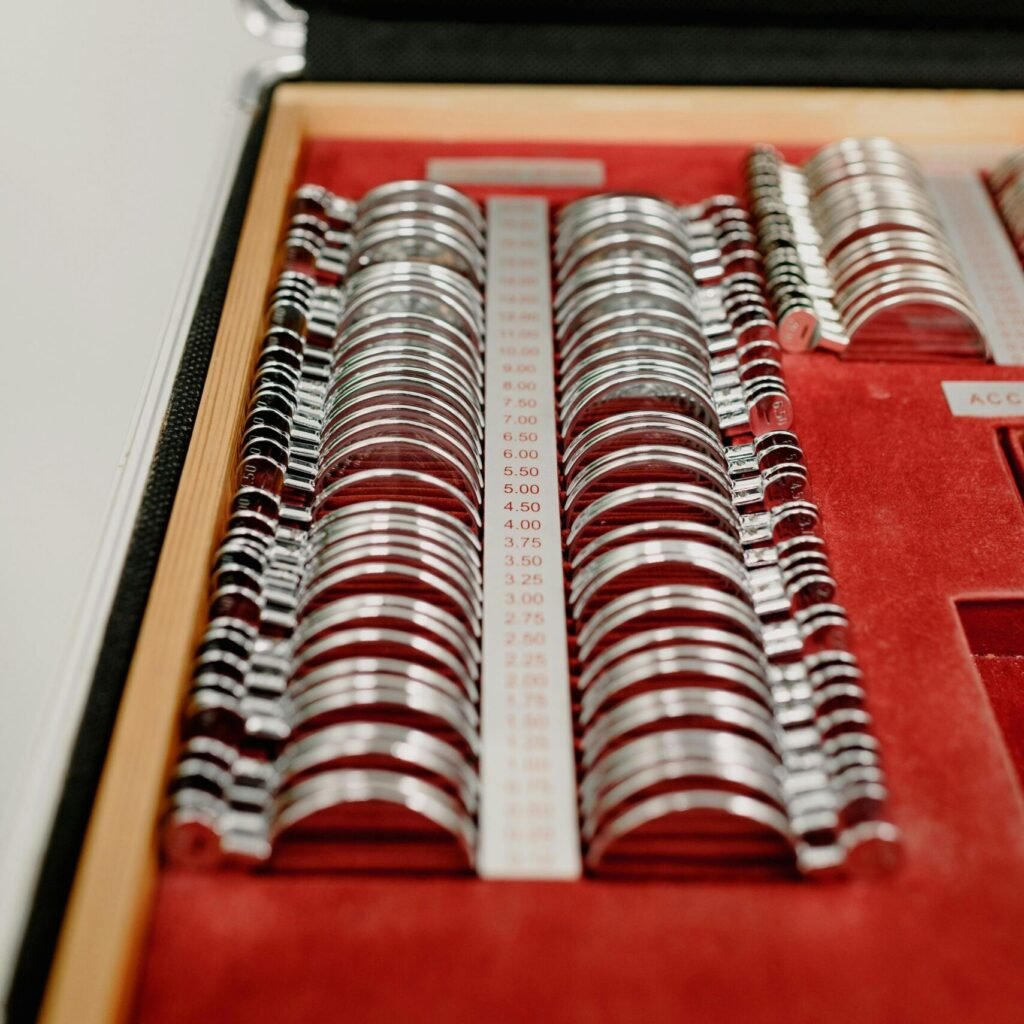 Optometrist diagnostic case with assorted lenses for vision testing.